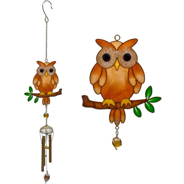 Decorative owl wind chime with hanging bells on a white background