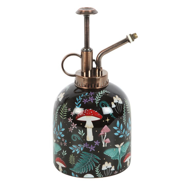 Decorative spray bottle with mushroom and leaf pattern on a white background