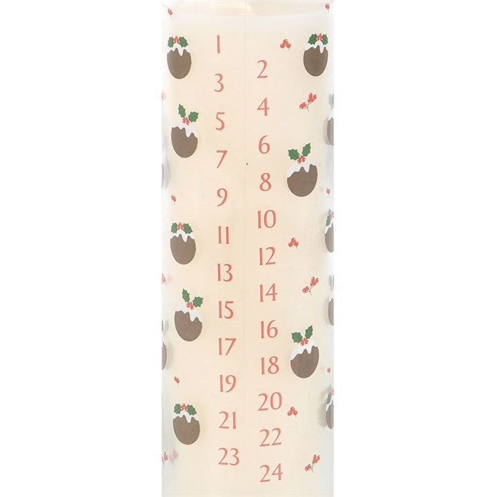 Candle with advent calendar design featuring numbers and Christmas pudding patterns on a white background.