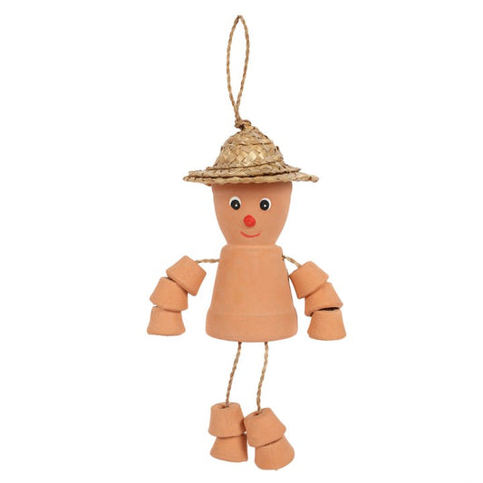 Decorative scarecrow figure with a straw hat on a white background
