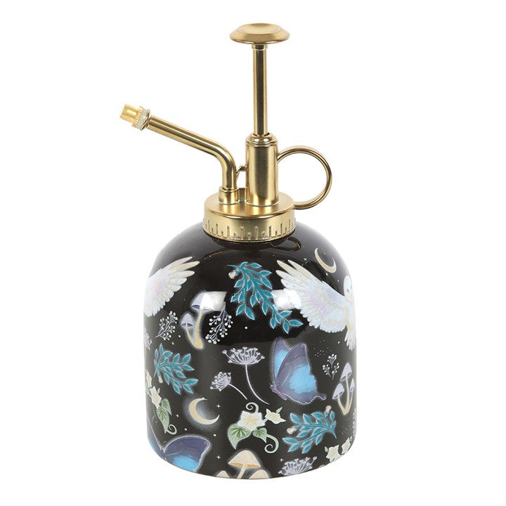 Decorative spray bottle with floral design on a white background