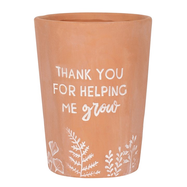 Terracotta pot with white text and floral designs on a white background