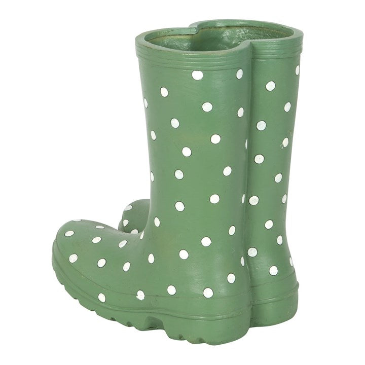 Green rain boot with white polka dots on a white background
