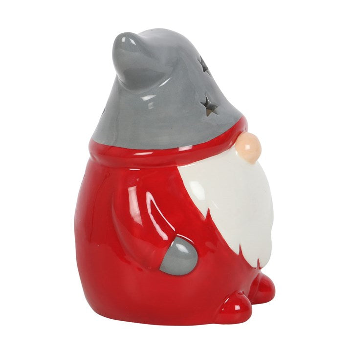 Ceramic gnome figurine with red outfit and gray hat on a white background