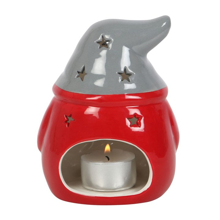 Red ceramic tea light holder with gray top and star cutouts on a white background