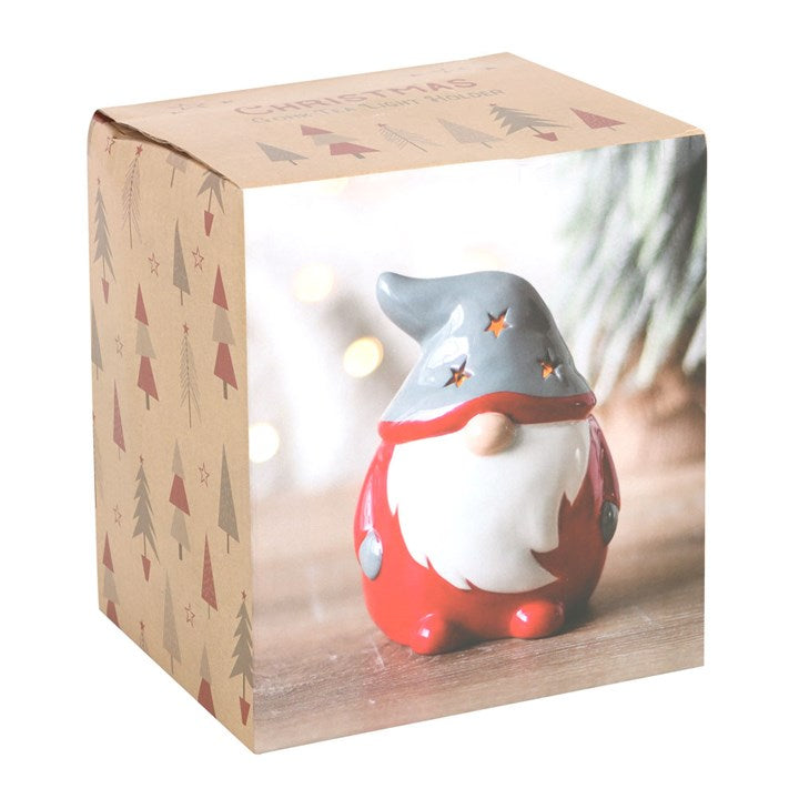 Decorative gnome figure in a box with Christmas tree pattern