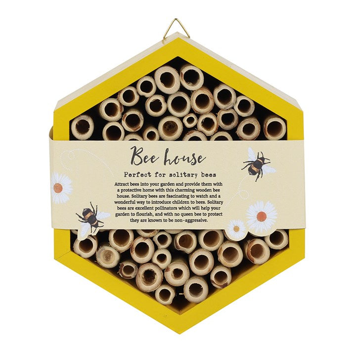 Hexagonal bee house with wooden tubes and a yellow border on a white background