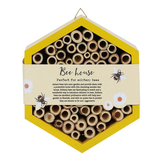 Hexagonal bee house with wooden tubes and a yellow border on a white background