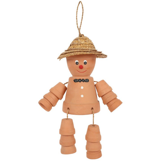 Decorative terracotta scarecrow with a straw hat on a white background
