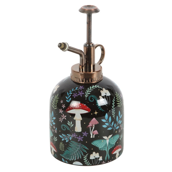Decorative ceramic plant mister bottle with fairy and mushroom design on a white background