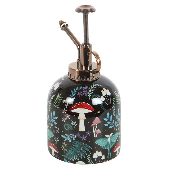 Decorative mist spray bottle with fairy and mushroom design on a black background