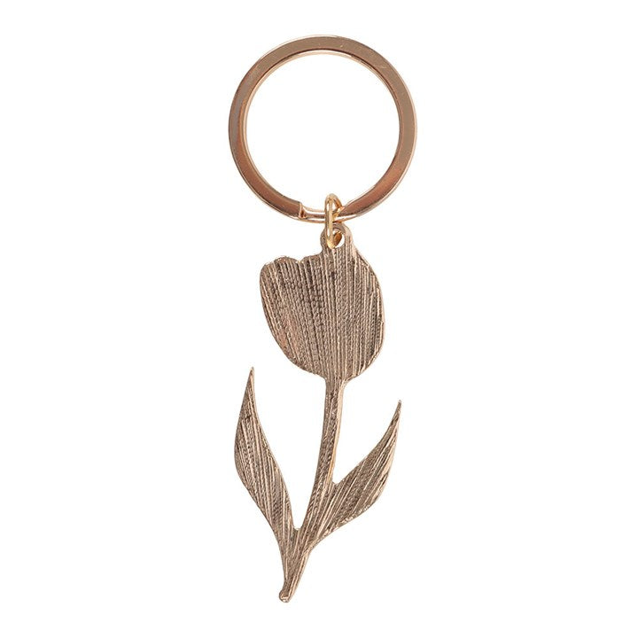 Rose gold tulip-shaped keychain on a white background